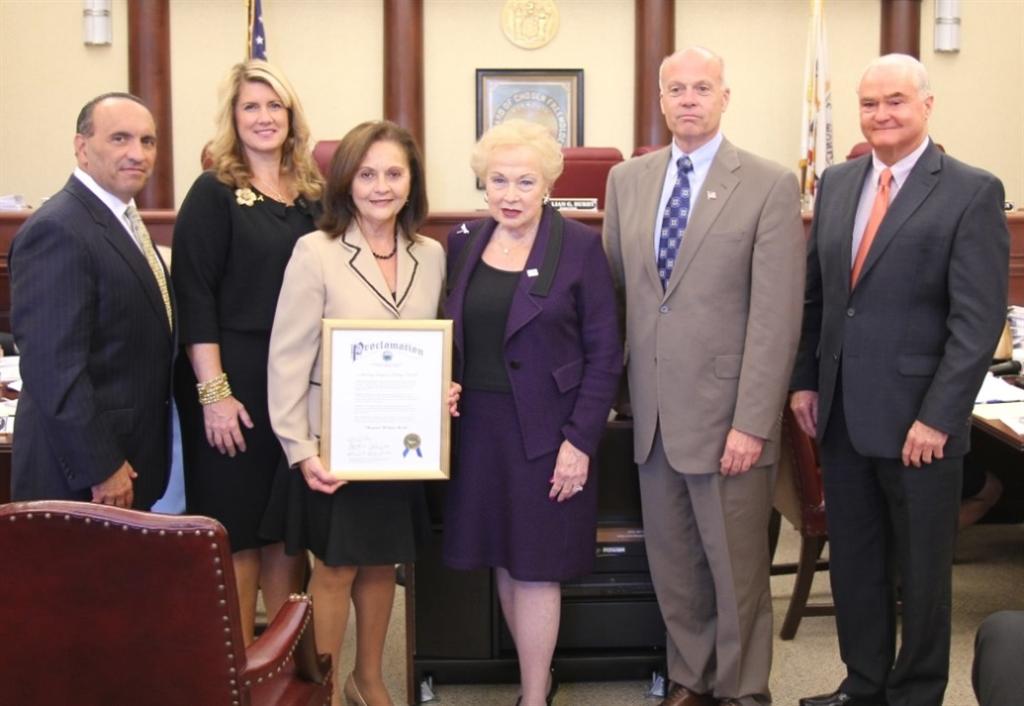 The Monmouth County Board of Chosen Freeholders presents a proclamation declaring “Hispanic Heritage Month” in Monmouth County to Violeta Peters, president of the Latino American Association of Monmouth County, Inc. Pictured left to right: Freeholder Thomas A. Arnone, Freeholder Serena DiMaso, Violeta Peters, Freeholder Director Lillian G. Burry, Freeholder Deputy Director Gary J. Rich, Sr. and Freeholder John P. Curley on Sept. 23, 2014 in Freehold, NJ.